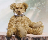 Walter is a large traditional one of a kind artist teddy bear in antique gold mohair by Barbara Ann Bears with an Edwardian collar he stands 21.5 inches/54cm tall. Walter has beige wool-felt paw pads, amber glass eyes, a neat hand embroidered nose and a sweet smile. Walter comes with an Edwardian style shirt collar and stud.