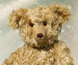 Walter is a large traditional one of a kind artist teddy bear in antique gold mohair by Barbara Ann Bears with an Edwardian collar he stands 21.5 inches/54cm tall. Walter has beige wool-felt paw pads, amber glass eyes, a neat hand embroidered nose and a sweet smile. Walter comes with an Edwardian style shirt collar and stud, but decided to take it off for this photo.