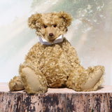 Walter is a large traditional one of a kind artist teddy bear in antique gold mohair by Barbara Ann Bears with an Edwardian collar he stands 21.5 inches/54cm tall. Walter has beige wool-felt paw pads, amber glass eyes, a neat hand embroidered nose and a sweet smile. Walter comes with an Edwardian style shirt collar and stud.