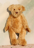 Wilfred is a very sweet and friendly artist teddy bear in gorgeous mohair by Barbara Ann Bears, he is 12 inches/30 cm tall and is 8.5 inches/21 cm sitting. Wilfred is made from a wonderful antique gold mohair with brown wool felt paw pads and gorgeous amber glass eyes. Wilfred has a carefully embroidered brown nose