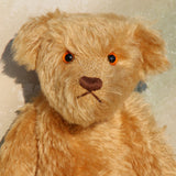 Wilfred is a very sweet and friendly artist teddy bear in gorgeous mohair by Barbara Ann Bears, he is 12 inches/30 cm tall and is 8.5 inches/21 cm sitting. Wilfred is made from a wonderful antique gold mohair with brown wool felt paw pads and gorgeous amber glass eyes. Wilfred has a carefully embroidered brown nose