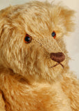Wilfred is a very sweet and friendly artist teddy bear in gorgeous mohair by Barbara Ann Bears, he is 12 inches/30 cm tall and is 8.5 inches/21 cm sitting. Wilfred is made from a wonderful antique gold mohair with brown wool felt paw pads and gorgeous amber glass eyes. Wilfred has a carefully embroidered brown nose