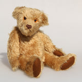 Wilfred is a very sweet and friendly artist teddy bear in gorgeous mohair by Barbara Ann Bears, he is 12 inches/30 cm tall and is 8.5 inches/21 cm sitting. Wilfred is made from a wonderful antique gold mohair with brown wool felt paw pads and gorgeous amber glass eyes. Wilfred has a carefully embroidered brown nose