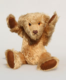 Wilfred is a very sweet and friendly artist teddy bear in gorgeous mohair by Barbara Ann Bears, he is 12 inches/30 cm tall and is 8.5 inches/21 cm sitting. Wilfred is made from a wonderful antique gold mohair with brown wool felt paw pads and gorgeous amber glass eyes. Wilfred has a carefully embroidered brown nose