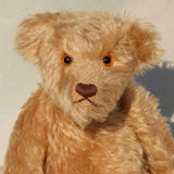 Wilfred is a very sweet and friendly artist teddy bear in gorgeous mohair by Barbara Ann Bears, he is 12 inches/30 cm tall and is 8.5 inches/21 cm sitting. Wilfred is made from a wonderful antique gold mohair with brown wool felt paw pads and gorgeous amber glass eyes. Wilfred has a carefully embroidered brown nose