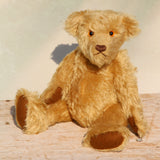 Wilfred is a very sweet and friendly artist teddy bear in gorgeous mohair by Barbara Ann Bears, he is 12 inches/30 cm tall and is 8.5 inches/21 cm sitting. Wilfred is made from a wonderful antique gold mohair with brown wool felt paw pads and gorgeous amber glass eyes. Wilfred has a carefully embroidered brown nose