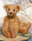 Ambrose is a charming, traditional one of a kind artist bear in German mohair by Barbara Ann Bears, he stands 10 inches/27 cm tall and is 7.5 inches/22 cm sitting. Ambrose is made from beautiful, slightly wavy, warm antique gold German mohair with fawn ultrasuede paw pads and vintage boot buttons for eyes