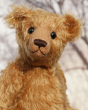 Ambrose is a charming, traditional one of a kind artist bear in German mohair by Barbara Ann Bears, he stands 10 inches/27 cm tall and is 7.5 inches/22 cm sitting. Ambrose is made from beautiful, slightly wavy, warm antique gold German mohair with fawn ultrasuede paw pads and vintage boot buttons for eyes
