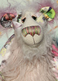 Amelie Papillion is an extremely beautiful, one of a kind artist bear by Barbara-Ann Bears, she stands 17.5 inches (44 cm) tall and is 12 inches (30 cm) sitting. Amelie Papillion is made from the most wonderful printed fabric, with areas of white, grey and pink and on top of this a myriad of fluttering butterflies