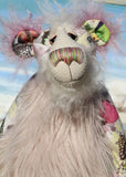 Amelie Papillion is an extremely beautiful, one of a kind artist bear by Barbara-Ann Bears, she stands 17.5 inches (44 cm) tall and is 12 inches (30 cm) sitting. Amelie Papillion is made from the most wonderful printed fabric, with areas of white, grey and pink and on top of this a myriad of fluttering butterflies