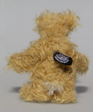 Amos is a very sweet and happy little artist bear by Barbara Ann Bears, he stands just 6.5 inches/16 cm tall and is 5 inches/12 cm sitting. He is made from a very long and fluffy beige mohair with beige wool felt paw pads, hand painted glass eyes with eyelids, a little hand embroidered nose and a beaming smile, and a white fluffy tail