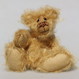 Amos is a very sweet and happy little artist bear by Barbara Ann Bears, he stands just 6.5 inches/16 cm tall and is 5 inches/12 cm sitting. He is made from a very long and fluffy beige mohair with beige wool felt paw pads, hand painted glass eyes with eyelids, a little hand embroidered nose and a beaming smile