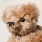 Angus is a very sweet and friendly artist teddy bear in gorgeous mohair by Barbara Ann Bears, he is 7.5 inches/19 cm tall and is 6 inches/15 cm sitting.  Angus is a wonderful traditional teddy bear, a bear we made in the early 1990s, he is made from a grey mohair that has very fine black threads running through it.  Angus has grey wool felt paw pads and gorgeous vintage boot buttons for eyes, he has a little, carefully embroidered black nose and a very relaxed and lovable expression.