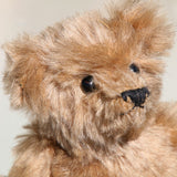 Angus is a very sweet and friendly artist teddy bear in gorgeous mohair by Barbara Ann Bears, he is 7.5 inches/19 cm tall and is 6 inches/15 cm sitting.  Angus is a wonderful traditional teddy bear, a bear we made in the early 1990s, he is made from a grey mohair that has very fine black threads running through it.  Angus has grey wool felt paw pads and gorgeous vintage boot buttons for eyes, he has a little, carefully embroidered black nose and a very relaxed and lovable expression.