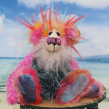 Anoushka Flambé a joyous celebration of colourful happiness, a one of a kind artist bear in hand dyed mohair & faux fur by Barbara-Ann Bears. Anoushka Flambé stands 10 inches( 25 cm) tall and is 7.5 inches ( 19 cm) sitting, this doesn't include her flaming hair which adds another 2.5 inches (7cm).