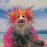 Anoushka Flambé a joyous celebration of colourful happiness, a one of a kind artist bear in hand dyed mohair & faux fur by Barbara-Ann Bears. Anoushka Flambé stands 10 inches( 25 cm) tall and is 7.5 inches ( 19 cm) sitting, this doesn't include her flaming hair which adds another 2.5 inches (7cm).
