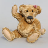 Bernadette is one of our very old bears, she's a sweet and cuddly, traditional teddy bear made from gorgeous English mohair by Barbara Ann Bears, she is 12 inches/30cm tall and is 9 inches/23cm sitting. Bernadette is made from a beautiful, slightly distressed, soft fawn English mohair, with beige wool felt paw pads