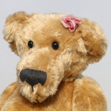 Bernadette is made from a beautiful, slightly distressed, soft fawn coloured English mohair, we used to love using English mohair, it had such a strong texture, it was made using looms dating back to the early 1900s, she has black, glass, spherical eyes, these catch the light from any angle so she always has a cheeky twinkle in her eye. Bernadette has quite a large, neatly sewn nose and a sweet smile