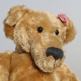 Bernadette is made from a beautiful, slightly distressed, soft fawn coloured English mohair, we used to love using English mohair, it had such a strong texture, it was made using looms dating back to the early 1900s, she has black, glass, spherical eyes, these catch the light from any angle so she always has a cheeky twinkle in her eye. Bernadette has quite a large, neatly sewn nose and a sweet smile