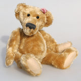 Bernadette is one of our very old bears, she's a sweet and cuddly, traditional teddy bear made from gorgeous English mohair by Barbara Ann Bears, she is 12 inches/30cm tall and is 9 inches/23cm sitting. Bernadette is made from a beautiful, slightly distressed, soft fawn English mohair, with beige wool felt paw pads