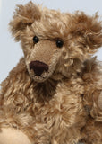 Bernard McFluff is made from a beautiful, distressed, shaggy, soft brown English mohair. He has black Austrian glass, spherical eyes, these catch the light from any angle so he always has a cheeky twinkle in his eye. Bernard McFluff has a neatly sewn nose and a sweet smile.