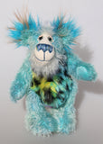 Billy Calypso is a gentle, happy teddy bear, a beautifully blue one of a kind, hand-dyed mohair artist bear by Barbara-Ann Bears Billy Calypso stands 9 inches/23 cm tall and is 6.5 inches/16 cm sitting. He is mainly made from a fluffy, sparse mohair that Barbara has hand dyed a beautiful sky blue