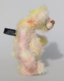 Blossom is a sweet and gently colourful, one of a kind mohair artist bear by Barbara-Ann Bears, she stands 10 inches/25 cm tall and is 8 inches/20 cm sitting. Blossom is made from medium length wildly curly mohair that Barbara has hand dyed a soft primrose yellow and delicate pink with matching hand dyed velvet paw pads