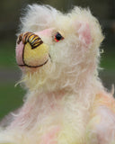 Blossom is a delightful and pretty little bear with a very sweet personality. She loves to sit in a quiet garden listening to the birds and smelling the flowers, then in the evening she likes a few cakes, to read books and to sit quietly with her family listening to all their stories. Blossom has beautiful, hand painted eyes with eyelids, a splendid nose embroidered from individual threads to compliment her colouring and she has a sweet, friendly smile