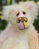 Blossom is a delightful and pretty little bear with a very sweet personality. She loves to sit in a quiet garden listening to the birds and smelling the flowers, then in the evening she likes a few cakes, to read books and to sit quietly with her family listening to all their stories. Blossom has beautiful, hand painted eyes with eyelids, a splendid nose embroidered from individual threads to compliment her colouring and she has a sweet, friendly smile