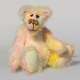 Blossom is a sweet and gently colourful, one of a kind mohair artist bear by Barbara-Ann Bears, she stands 10 inches/25 cm tall and is 8 inches/20 cm sitting. Blossom is made from medium length wildly curly mohair that Barbara has hand dyed a soft primrose yellow and delicate pink with matching hand dyed velvet paw pads