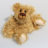 Bobbin is a wild and shaggy chap, a bear who loves to climb trees, sit around on gardening implements and generally get up to mischief. He has the childish charm of the naughty schoolboy that you can't help loving when you should be telling him to 'stop doing that' or 'get down out of there', he's just a little bear who needs love and cuddles.