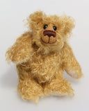 Bobbin is made from the most wonderful, wildly curly beige gold mohair, with a slightly warmer backcloth. Bobbin has beige German wool felt paw pads that blend with his mohair perfectly.