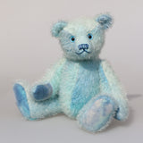 Bobby Daydream is a very handsome & subtly colourful, traditional, one of a kind artist teddy bear, in fabulous hand dyed mohair by Barbara Ann Bears, he stands 10 inches/25 cm tall and 7.5 inches/18 cm sitting. Bobby Daydream is made from a fairly short and sparse mohair, hand-dyed in natural blues, aqua and turquoise