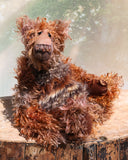Boris Stroganov is a wild yet friendly, one of a kind, artist bear by Barbara-Ann Bears, he stands 19 inches(48 cm) tall and is 15 inches(38 cm) sitting.  He is made from long, wild and shaggy mohair that Barbara has hand-dyed in many beautiful hues of brown this is complemented by his long and very fluffy faux fur