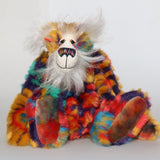 Bosworth Bloom is a very handsome and beautifully coloured one of a kind artist bear, he stands 15.5 inches/39 cm tall and is 12 inches (30 cm) sitting. Bosworth Bloom is made from a stunning piece of faux fur with a navy backing with floral motifs in gold, jade, cyan and red, and a very long and fluffy white mohair used for his face, ears and tail