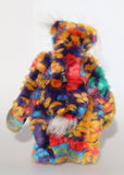 Bosworth Bloom is a very handsome and beautifully coloured one of a kind artist bear, he stands 15.5 inches/39 cm tall and is 12 inches (30 cm) sitting. Bosworth Bloom is made from a stunning piece of faux fur with a navy backing with floral motifs in gold, jade, cyan and red, and a very long and fluffy white mohair used for his face, ears and tail