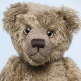 Bosworth is a solid and distinguished one of a kind, traditional, mohair artist teddy bear by Barbara Ann Bears, he stands 17 inches (43cm) tall and is 12 inches (31cm) sitting and made from fairly long, slightly wavy greyish-brown brown mohair with a hint of green, he has beige wool felt paw pads and hand painted eyes