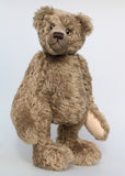 Bosworth is a solid and distinguished one of a kind, traditional, mohair artist teddy bear by Barbara Ann Bears, he stands 17 inches (43cm) tall and is 12 inches (31cm) sitting and made from fairly long, slightly wavy greyish-brown brown mohair with a hint of green, he has beige wool felt paw pads and hand painted eyes