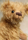 Braithwaite, a lovable slightly raggedy, one of a kind, traditional artist teddy bear made from beautiful German mohair by Barbara-Ann Bears. Braithwaite stands 11 inches (28cm) tall and is 8 inches (20cm) sitting. Braithwaite comes from the same design as we used to make Marigold's teddy bear for Downton Abbey