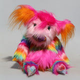 Britney is mostly made from a long, soft rainbow faux fur which is in bands of orange, yellow, turquoise, violet magenta and baby pink. Her head is a long, soft baby pink faux fur, the backs of her ears and her tummy band are a very long and soft magenta faux fur, the fronts of her ears are an even longer orange faux fur and the top of her head and the tip of her tail are a very long vivid magenta faux fur. Her hair is tied to stop it getting her eyes. Britney has hand dyed velvet hoofs