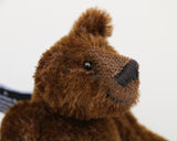 Bruce McCubbin is a sweet and happy little bear. Bruce likes to think he's a proper little bear, that he can go our into the woods to hunt elk and reindeer, well at least beetles and acorns and maybe a spider if it isn't too scary. A bigger spider will have him running back to you, climbing up your back, over your shoulder until he is right in front of your face demanding a cuddle, well he's just a sweet little bear and he's very good at warning you if big hairy spiders are about.