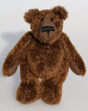 Bruce McCubbin is a very sweet and happy little brown mohair artist bear by Barbara Ann Bears, he stands just 6 inches( 15 cm) tall and is 4.5 inches (11 cm) sitting. Bruce McCubbin is made from a short, stubbly brown mohair, perfect mohair for a proper little bear, his paw pads are made from the same mohair trimmed