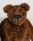 Bruce McCubbin is a sweet and happy little bear. Bruce likes to think he's a proper little bear, that he can go our into the woods to hunt elk and reindeer, well at least beetles and acorns and maybe a spider if it isn't too scary. A bigger spider will have him running back to you, climbing up your back, over your shoulder until he is right in front of your face demanding a cuddle, well he's just a sweet little bear and he's very good at warning you if big hairy spiders are about.