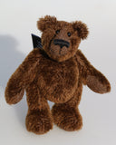 Bruce McCubbin is a very sweet and happy little brown mohair artist bear by Barbara Ann Bears, he stands just 6 inches( 15 cm) tall and is 4.5 inches (11 cm) sitting. Bruce McCubbin is made from a short, stubbly brown mohair, perfect mohair for a proper little bear, his paw pads are made from the same mohair trimmed