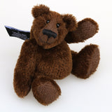 Bruce McCubbin is made from a short, stubbly (plain chocolate) brown mohair, perfect mohair for a proper little bear. Bruce's paw pads are made from the same mohair, trimmed down to the finest stubble. Bruce McCubbin has small spherical glass eyes, that catch the light whichever way you look at him, he has a pert little nose embroidered from fine black perle cotton and a beaming smile