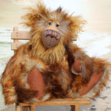 Bruno Hugmore is a very fluffy and cuddly, one of a kind artist teddy bear, in gorgeous faux fur and mohair by Barbara-Ann Bears Bruno Hugmore stands 17inches (43 cm) tall and is 13 inches (33 cm) sitting. He is a fairly large and fluffy bear in beautifully harmonious colours, like a walk through a forest in winter on a carpet of frosted leaves.