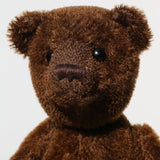 Bruno is a gorgeous little one of a kind traditional teddy bear made from beautiful rich brown mohair by Barbara Ann Bears. Bruno has antique black boot buttons for eyes, a perky little brown nose carefully and a sweet expression that seems both sad and hopeful, like a puppy.