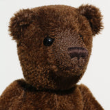 Bruno is a gorgeous little one of a kind traditional teddy bear made from beautiful rich brown mohair by Barbara Ann Bears. Bruno has antique black boot buttons for eyes, a perky little brown nose carefully and a sweet expression that seems both sad and hopeful, like a puppy.