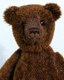 Bruno is a gorgeous little one of a kind traditional teddy bear made from beautiful rich brown mohair by Barbara Ann Bears. Bruno has antique black boot buttons for eyes, a perky little brown nose carefully and a sweet expression that seems both sad and hopeful, like a puppy.