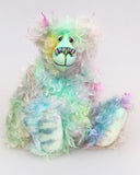 Bryn Bryn Bruin is an endearingly sweet and gentle one of a kind, hand dyed mohair artist bear by Barbara-Ann Bears. He stands 12.5 inches/ 32 cm tall and is 10 inches/ 25 cm sitting.  Bryn Bryn Bruin is a beautifully coloured bear, like the reflections on a calm sea just after sunset, a bear to lift your spirits and make you smile.